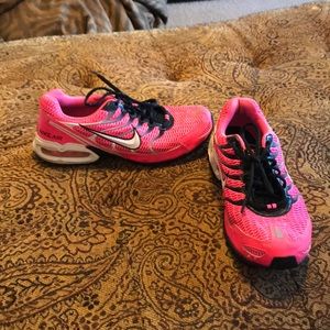 Pink black and white nike torch 4